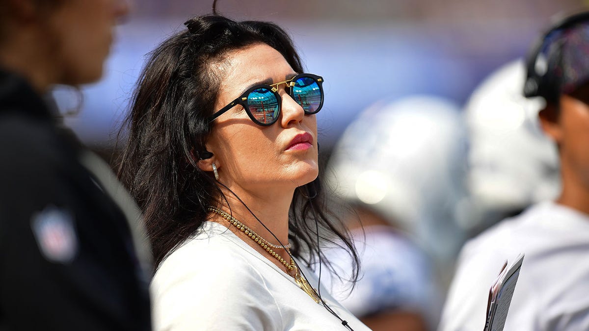 Carlie Irsay-Gordon watching game action at SoFi Stadium