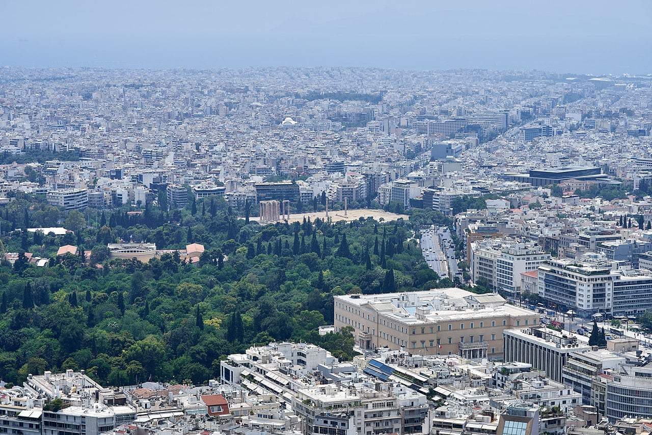Aerial view of Athens, Greece. Who is primarily responsible for tax evasion in Athens, Greece?