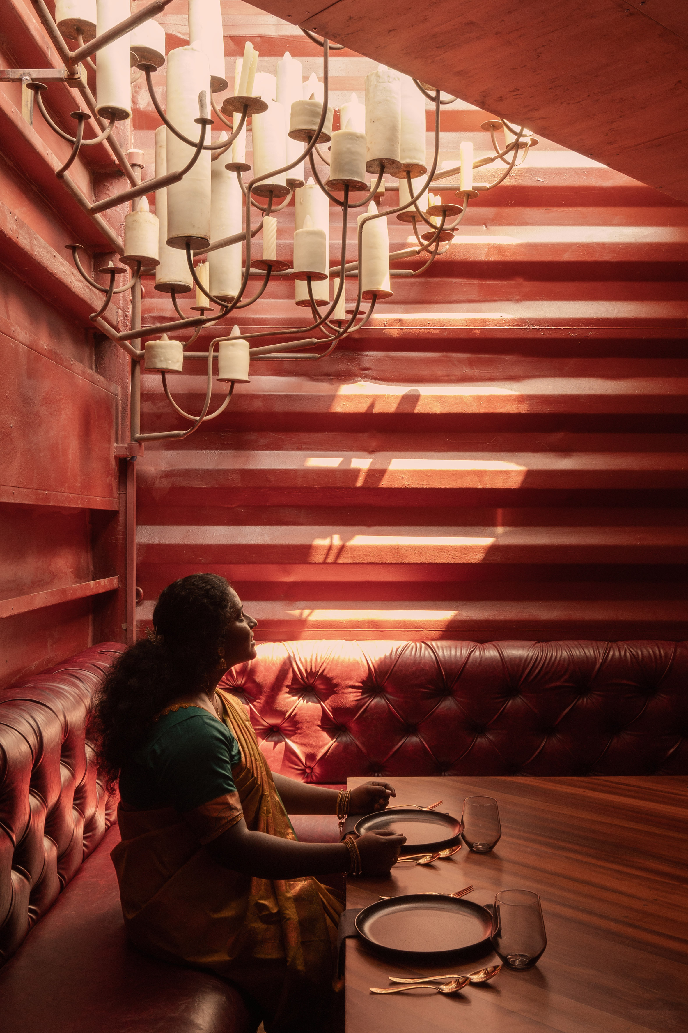 Red-walled restaurant interior in Tamil Nadu
