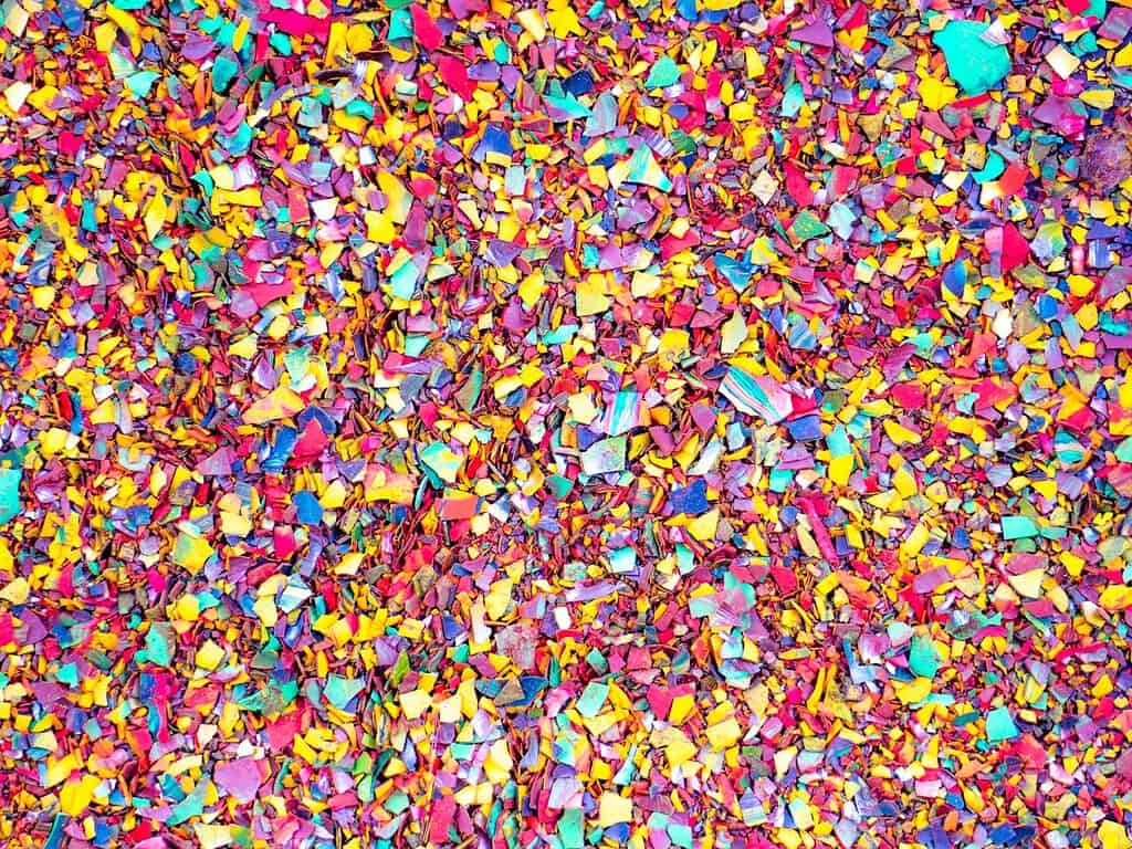 Confetti in vibrant colors including pink, yellow, blue, and purple, creating a festive and lively a.