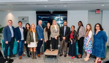 Speakers and organizers gather at the Healthcare + AI Forum hosted by Arlington Economic Development on March 26.