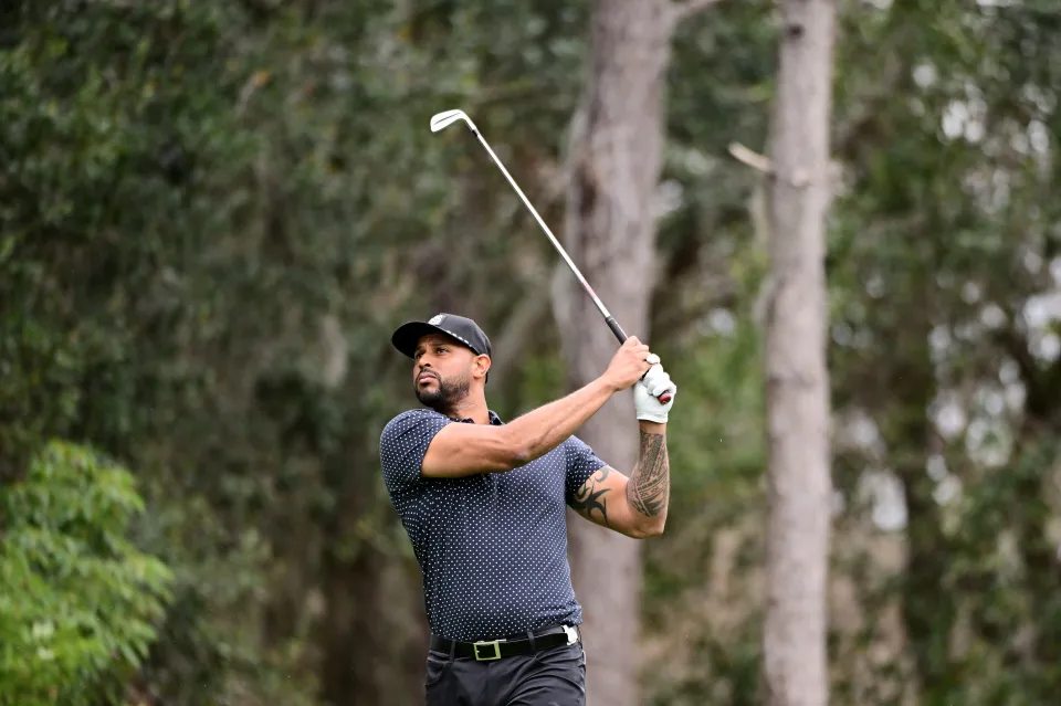 Professional baseball player Aaron Hicks plays his shot from the sixth tee during the first round of the Hilton Grand Vacations Tournament of Champions at Lake Nona Golf & Country Club on January 18, 2024 in Orlando, Florida.