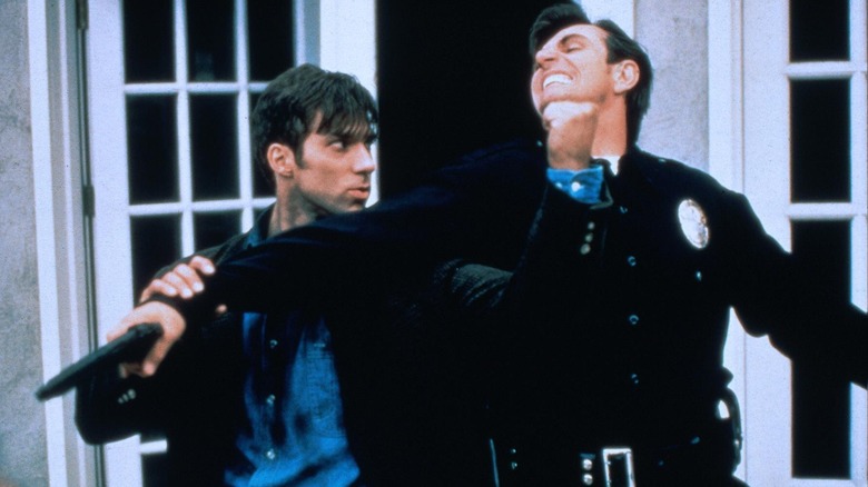 Alex (Gary Daniels) fights a cop in 
