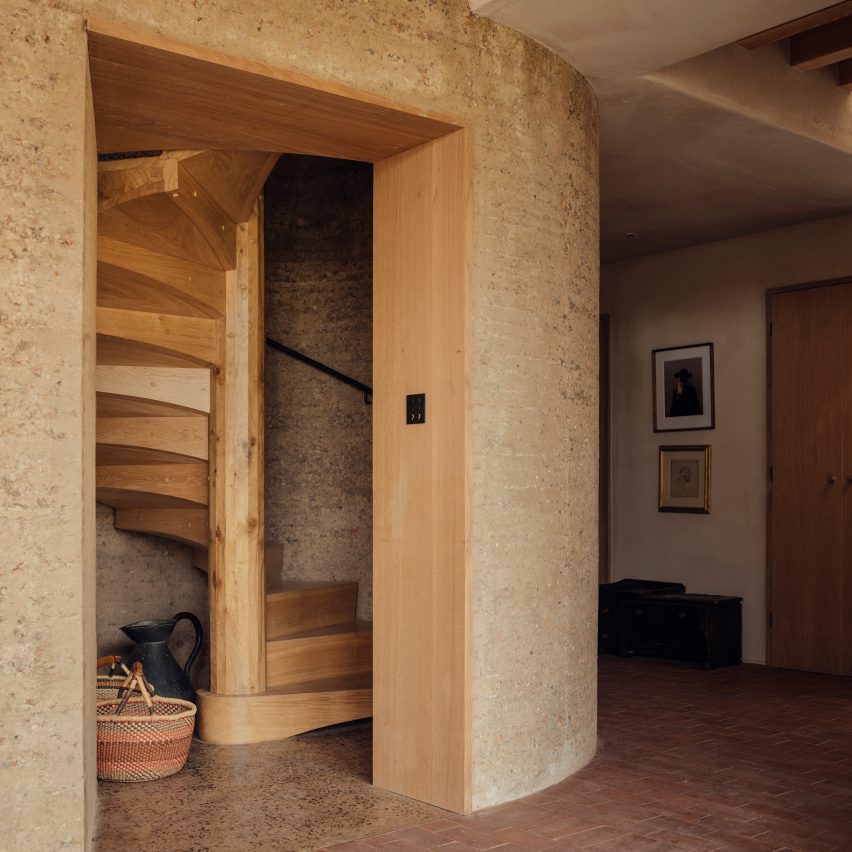 Staircase of Rammed Earth House by Tuckey Design