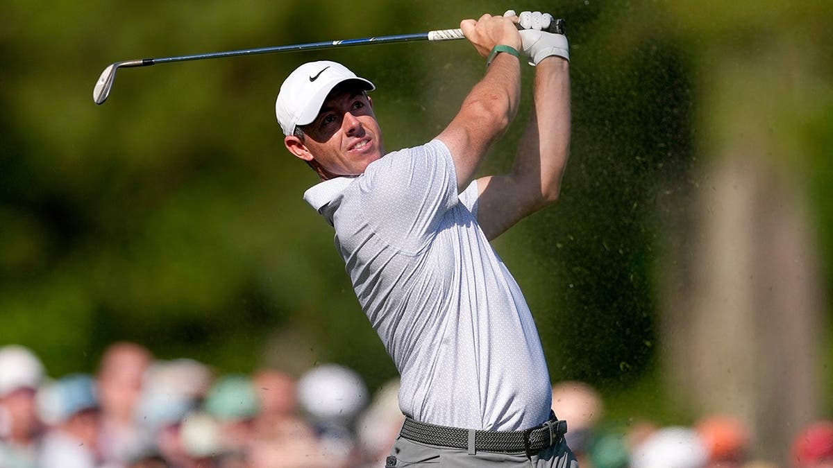 Rory McIlroy watching his tee shot on the 12th hole at Augusta National Golf Club