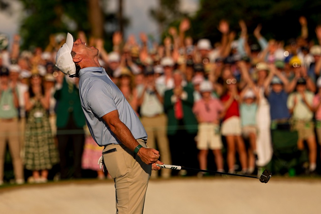 Rory McIlroy celebrates after sinking the winning putt at The Masters on April 12, 2026.
