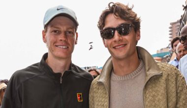Jannik Sinner and George Russell pose for a photo after Sinner's quarter-final win in Monte-Carlo Friday.