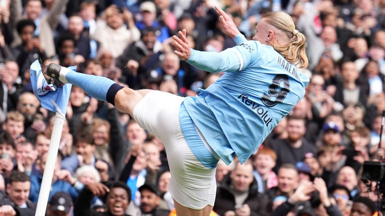 Erling Haaland celebrates after scoring his second goal of the game against Liverpool