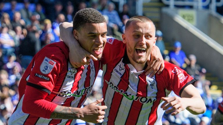 Ryan One of Lincoln City, left, celebrates scoring the opening goal with team-mate Tom Hamer