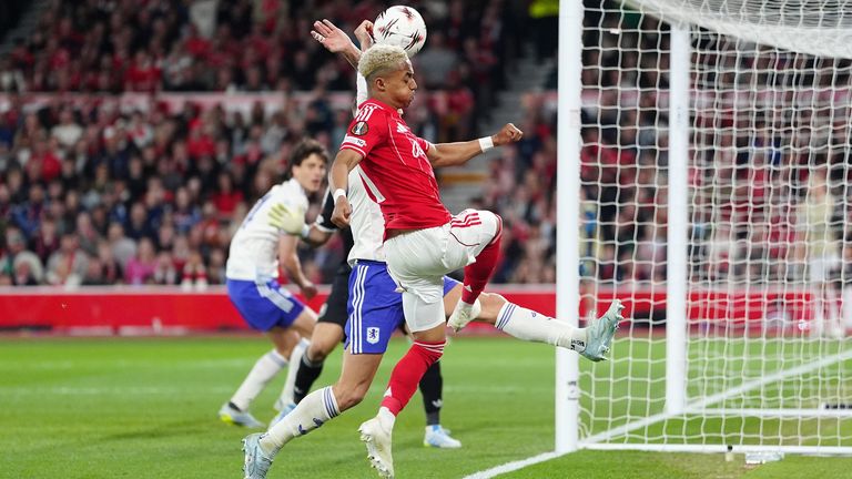 Aston Villa's Lucas Digne (partially blocked) handles the ball in the penalty area resulting in a penalty to Nottingham Forest
