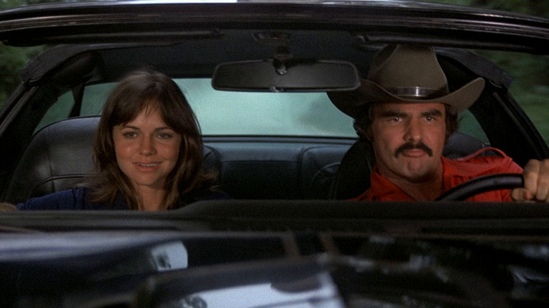 Sally Field as Frog and Burt Reynolds as Bandit, taking a drive in Smokey and the Bandit