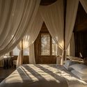 © You Pu Songtsm Travel Hotel Jiuzhai / Thinking Design - Interior Photography, Bedroom, Bed, Wood, Lighting
