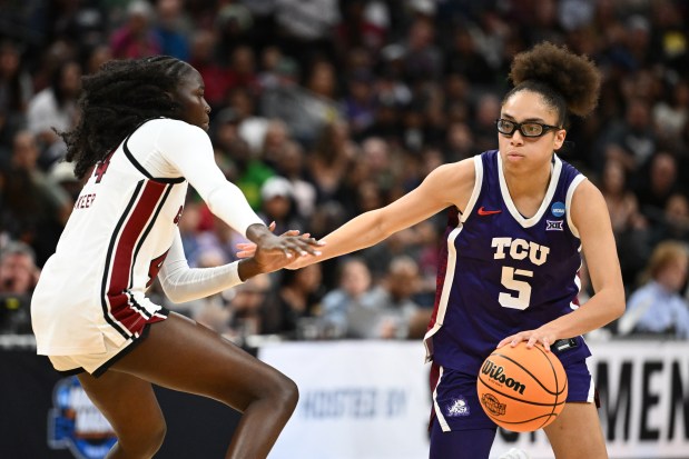 TCU point guard Olivia Miles drives to the basket against Agot Makeer of South Carolina in the Gamecocks's Elite Eight victory at Golden 1 Center on March 30, 2026 in Sacramento, California. (Photo by Thien-An Truong/Getty Images)