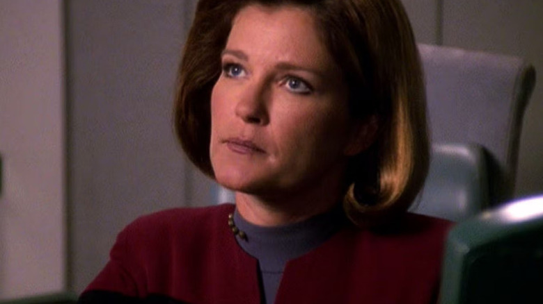 Kate Mulgrew ponders a decision in 