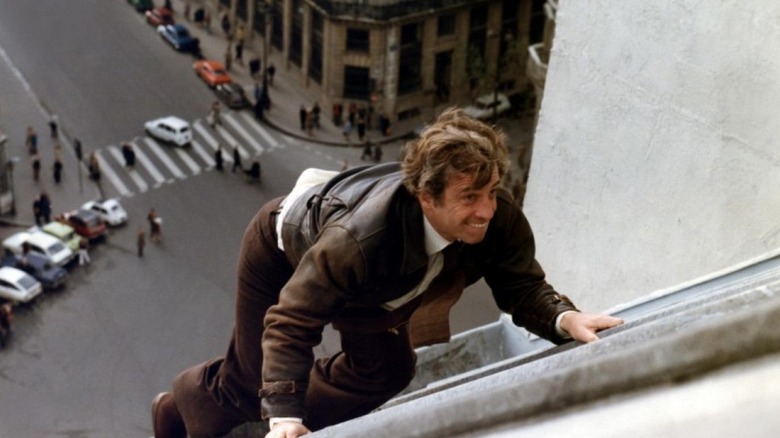 Jean-Paul Belmondo as Letellier, chasing a perp on a roof in The Night Caller