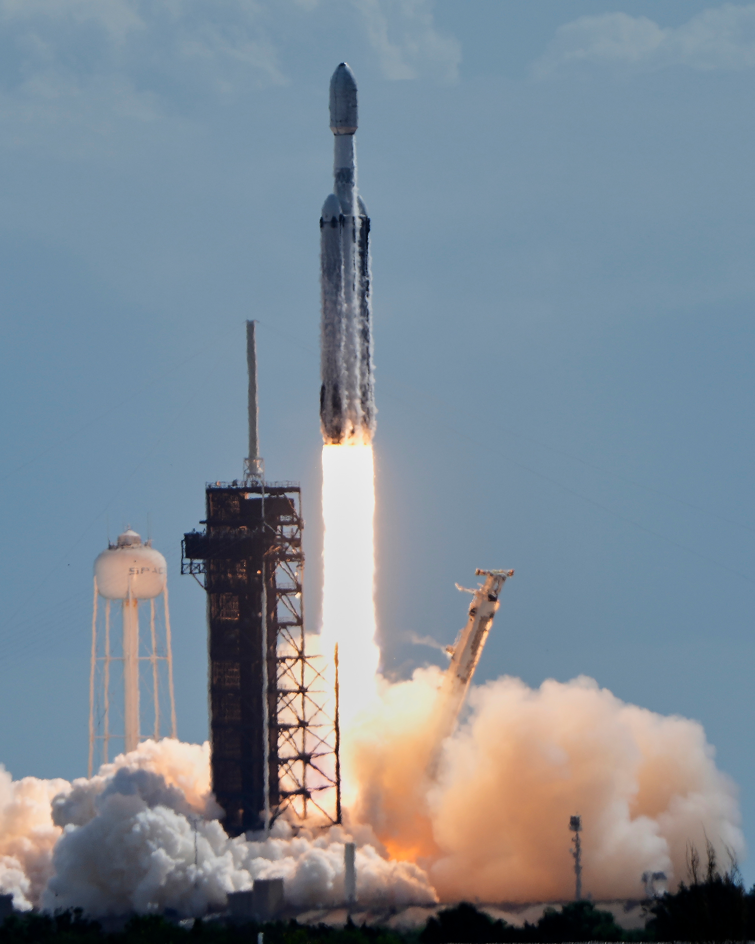 A SpaceX Falcon Heavy rocket lifts off from pad 39A...