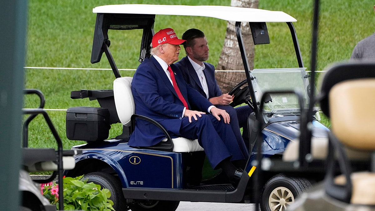 President Donald Trump arriving at Trump National Doral driven by his son Eric Trump