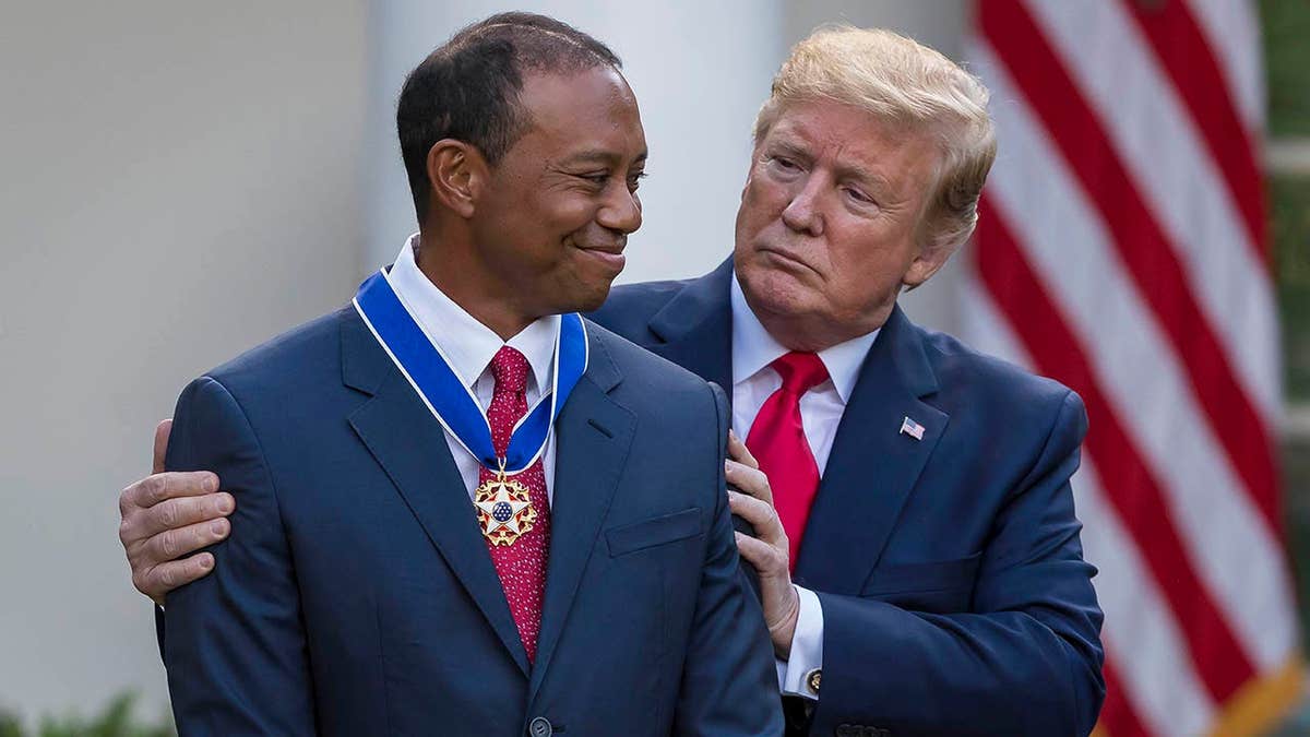 President Donald Trump presenting the Presidential Medal of Freedom to Tiger Woods in the White House Rose Garden