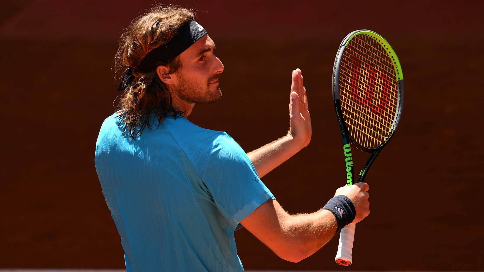 Stefanos Tsitsipas celebrates his win against Daniel Merida on Monday at the Mutua Madrid Open.