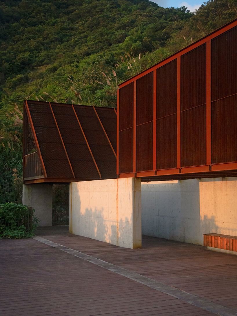 corten-clad twin pavilions frame shifting sea views along chinese coastal valley - 3