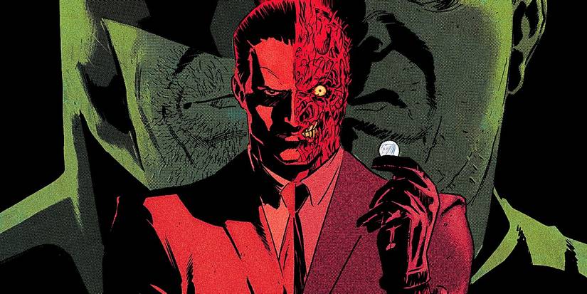Featured Image: Batman villain Two-Face, holding his iconic coin, with Batman in the background