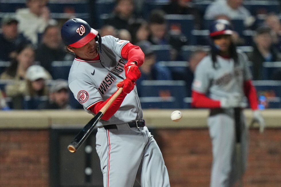 House hits grand slam and Nationals blow out staggering Mets 14-2 in rain