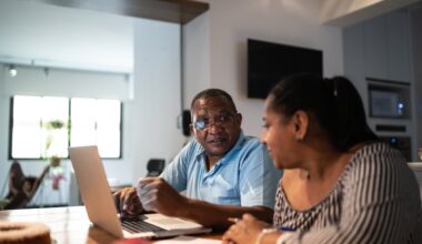 Adults looking at financial paperwork.
