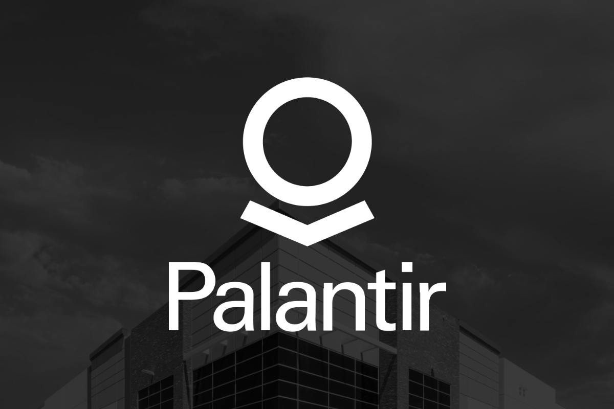 Palantir logo in front of backdrop with corporate building in background.