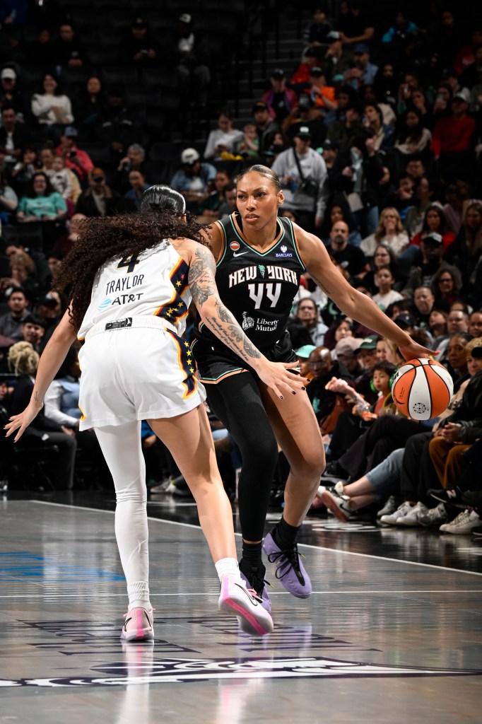 Betnijah Laney-Hamilton dribbles the ball during a WNBA pre-season game.
