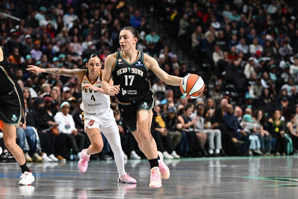 New York Liberty player Derin Erdogan dribbling the ball against the Indiana Fever.