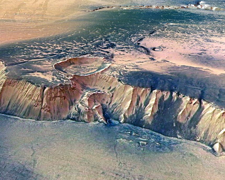 The Echus Chasma, one of the largest water source regions on Mars, as pictured from ESA's Mars Express. Scientists report that gigantic water falls may once have plunged over these cliffs on to the valley floor.