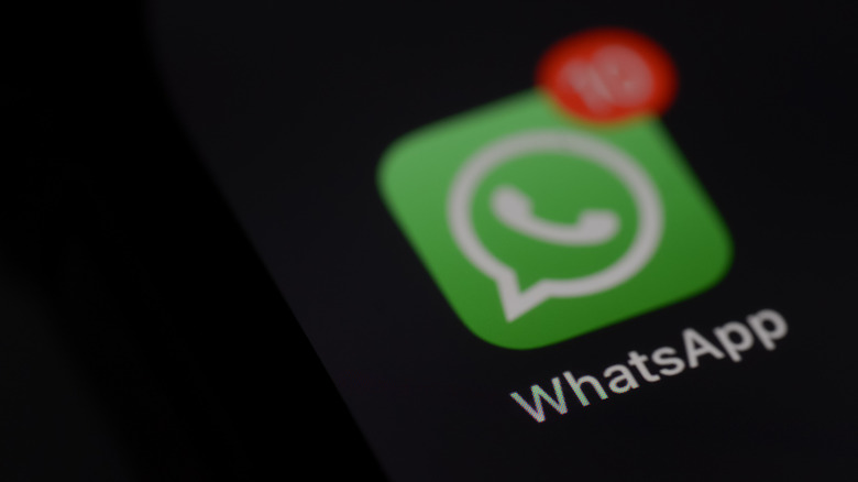 Close-up of smartphone displaying WhatsApp interface onscreen