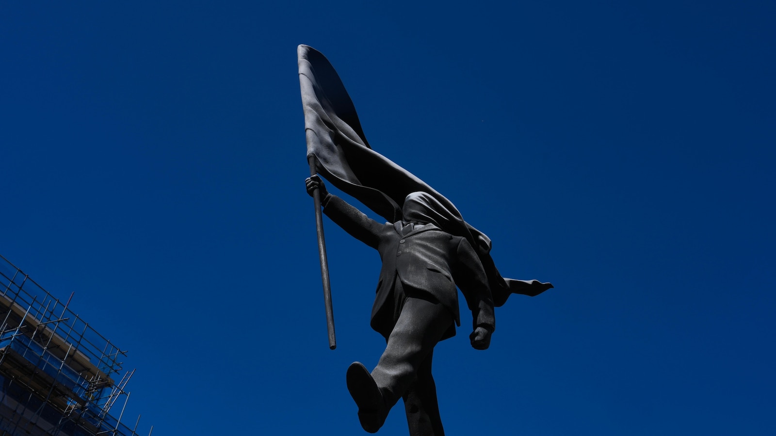 Banksy confirms a new statue in central London of a man blinded by a flag is his work