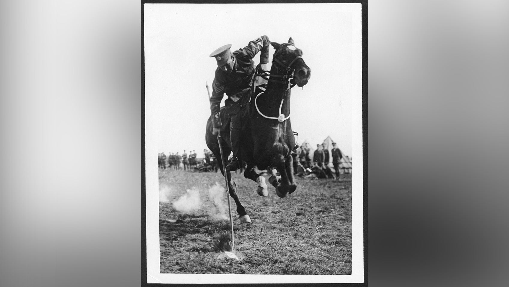 A WW1 British cavalryman riding a horse.