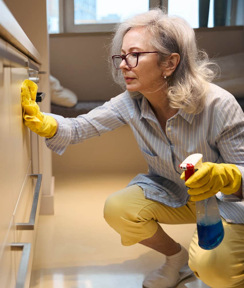focused person cleans cabinet to manage anxiety
