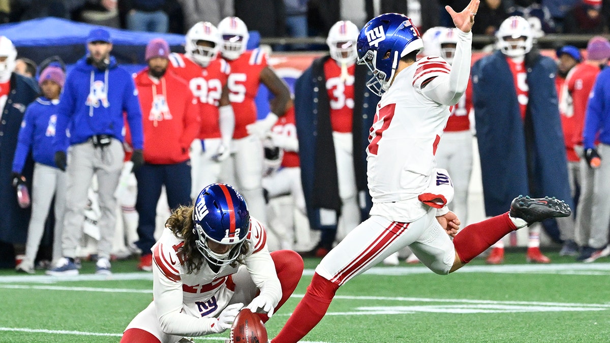 New York Giants place kicker Younghoe Koo kicking an extra point at Gillette Stadium.