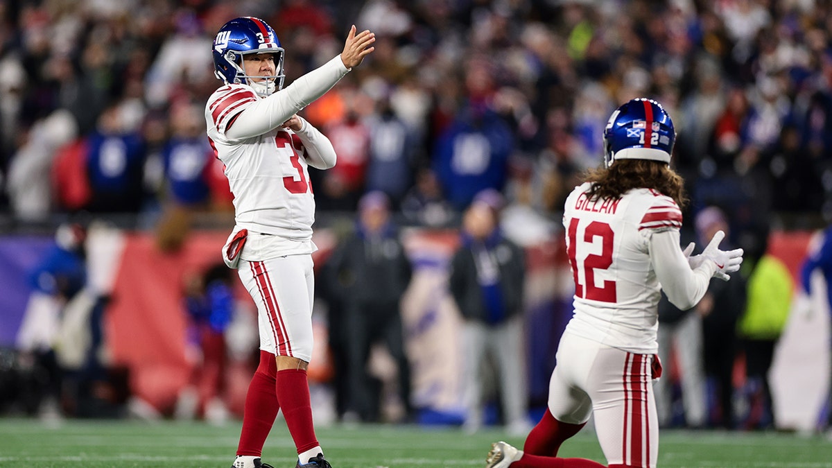 Younghoe Koo of the New York Giants lines up a kick at Gillette Stadium.