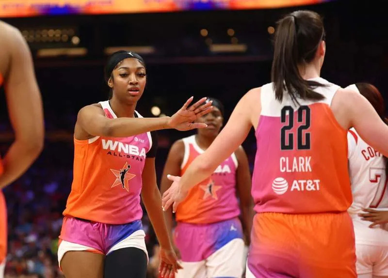 Jul 20, 2024; Phoenix, AZ, USA; Team WNBA guard Caitlin Clark (22) and Angel Reese against the USA Women’s National Team during the 2024 WNBA All Star Game at Footprint Center. Mandatory Credit: Mark J. Rebilas-USA TODAY Sports