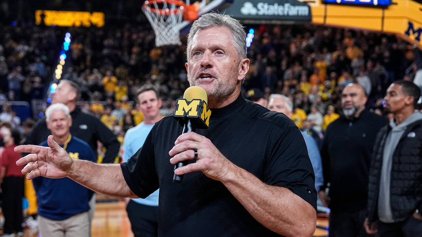 Michigan football head coach Kyle Whittingham speaks as he is being introduced on the floor during the first half between Michigan and USC at Crisler Center in Ann Arbor on Friday, Jan. 2, 2026.