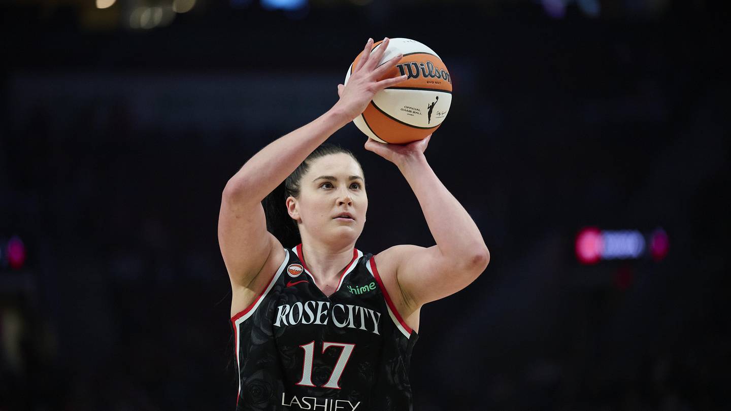 May 14, 2026; Portland, Oregon, USA; Portland Fire center Megan Gustafson (17) shoots a free throw during the first half against New York Liberty at Moda Center. Mandatory Credit: Troy Wayrynen-Imagn Images