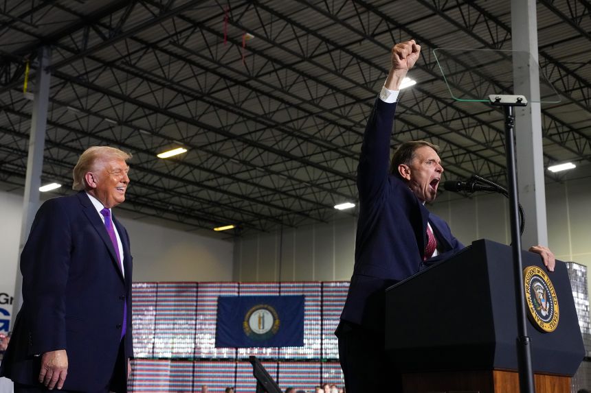 Ed Gallrein, a Republican congressional candidate for Kentucky, speaks as President Donald Trump looks during an event at Verst Logistics in Hebron, Kentucky, on March 11.