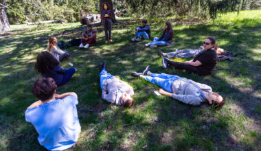Dr Susan Abookire begins the forest therapy session asking residents and medical student to relax in any way they wish. (Jesse Costa/WBUR)