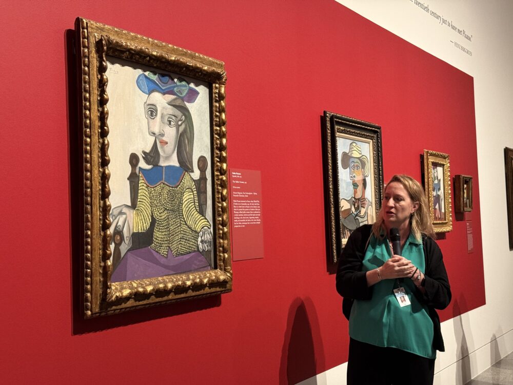 MFAH Curator of Prints and Drawings Dena Woodall speaks in front of Picasso's "The Yellow Sweater" painting