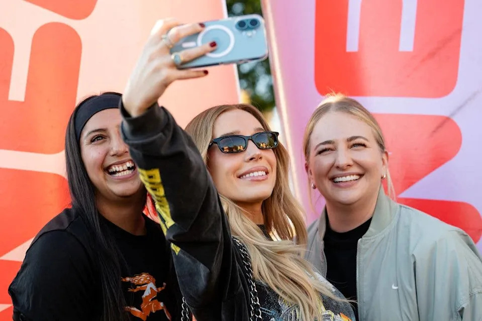 Alex Cooper takes photos with fans during the NWSL Fan Fest at the Unwell activation at The Lot at Creekside on November 22, 2025 in San Jose, California.
