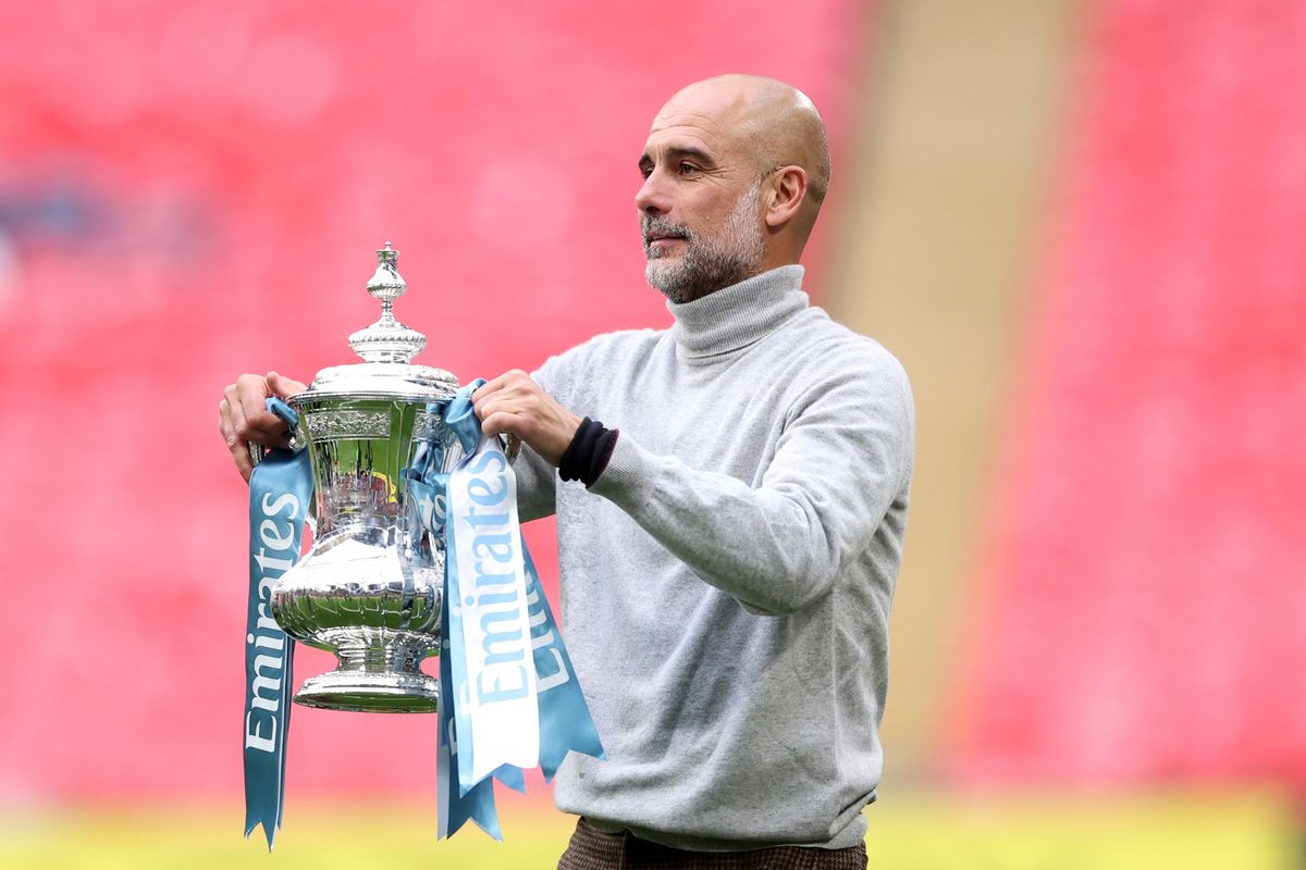 Pep Guardiola holds the FA Cup