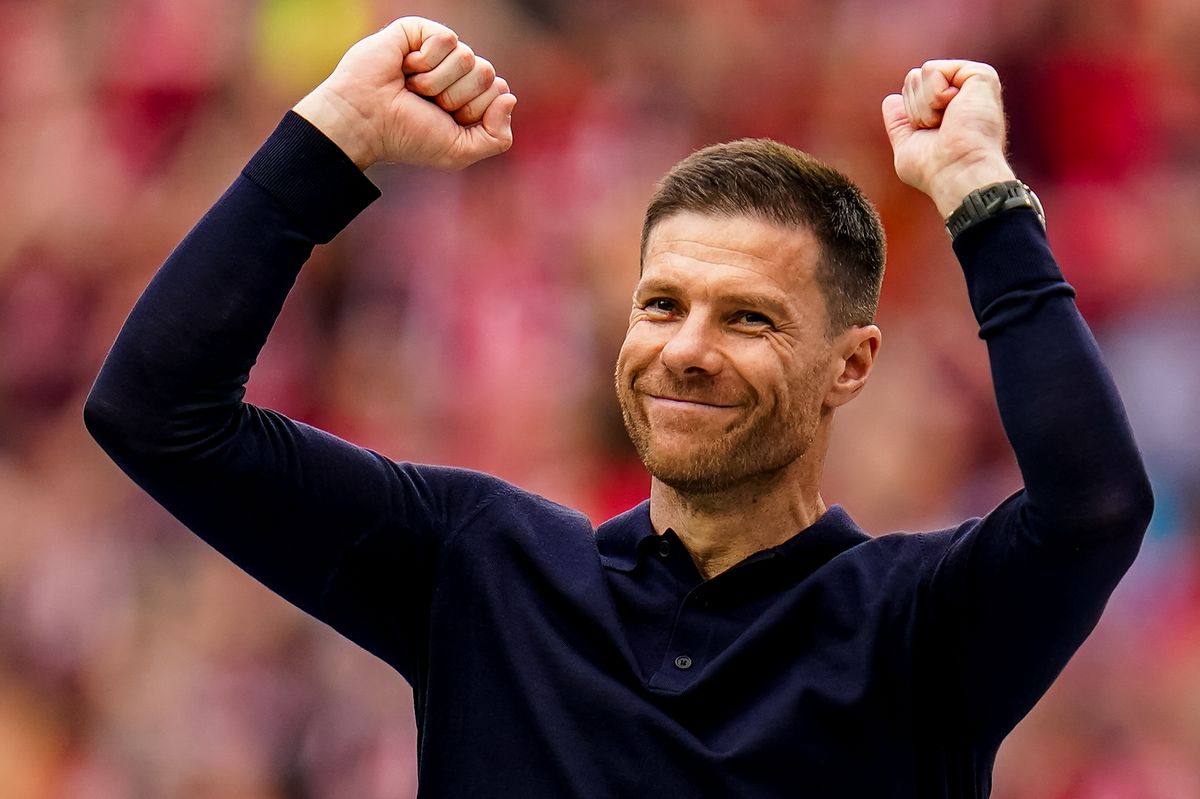 Bayer 04 Leverkusen head coach Xabi Alonso celebrates following winning the Bundeliga title after the Bundesliga match between Bayer 04 Leverkusen and FC Augsburg at BayArena on May 18, 2024