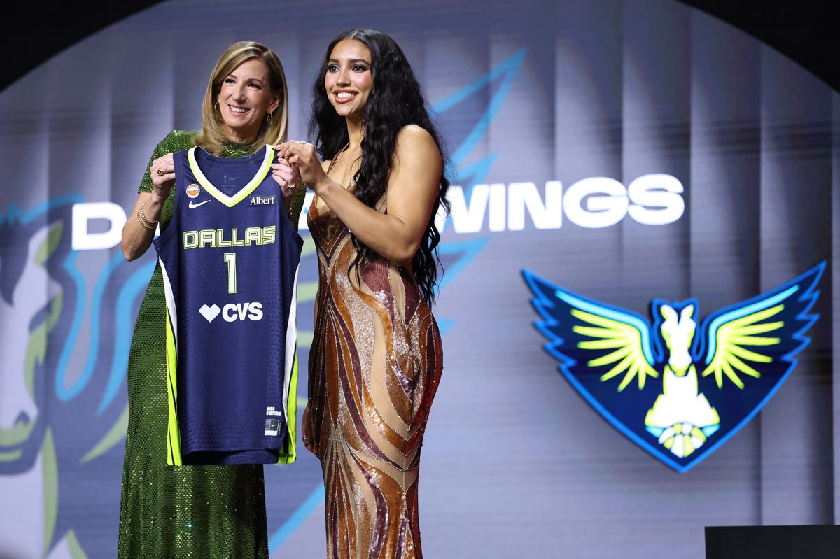 WNBA Commissioner Cathy Engelbert poses for a photo with Azzi Fudd