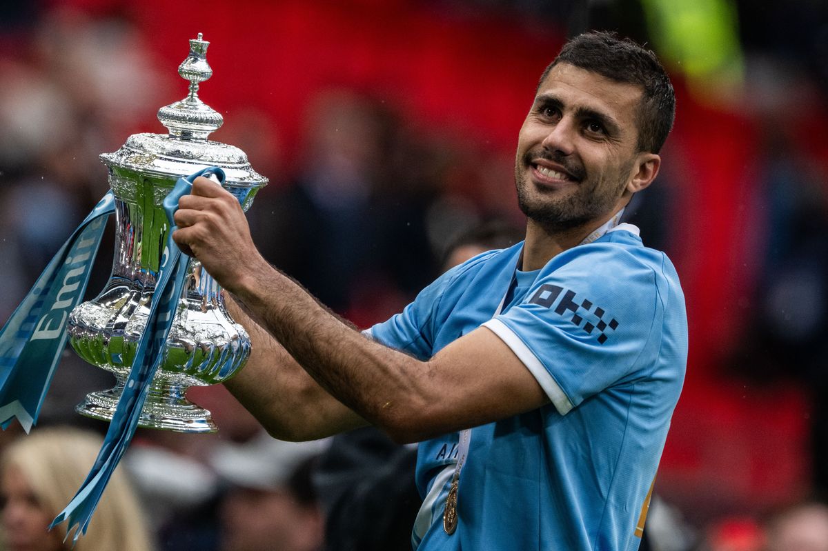 LONDON, ENGLAND - MAY 16: Rodri of Manchester City celebrates with the Emirates FA Cup trophy after his team's victory in the Emirates FA Cup Final match between Chelsea and Manchester City on May 16, 2026 in London, England. (Photo by Sebastian Frej/Getty Images)