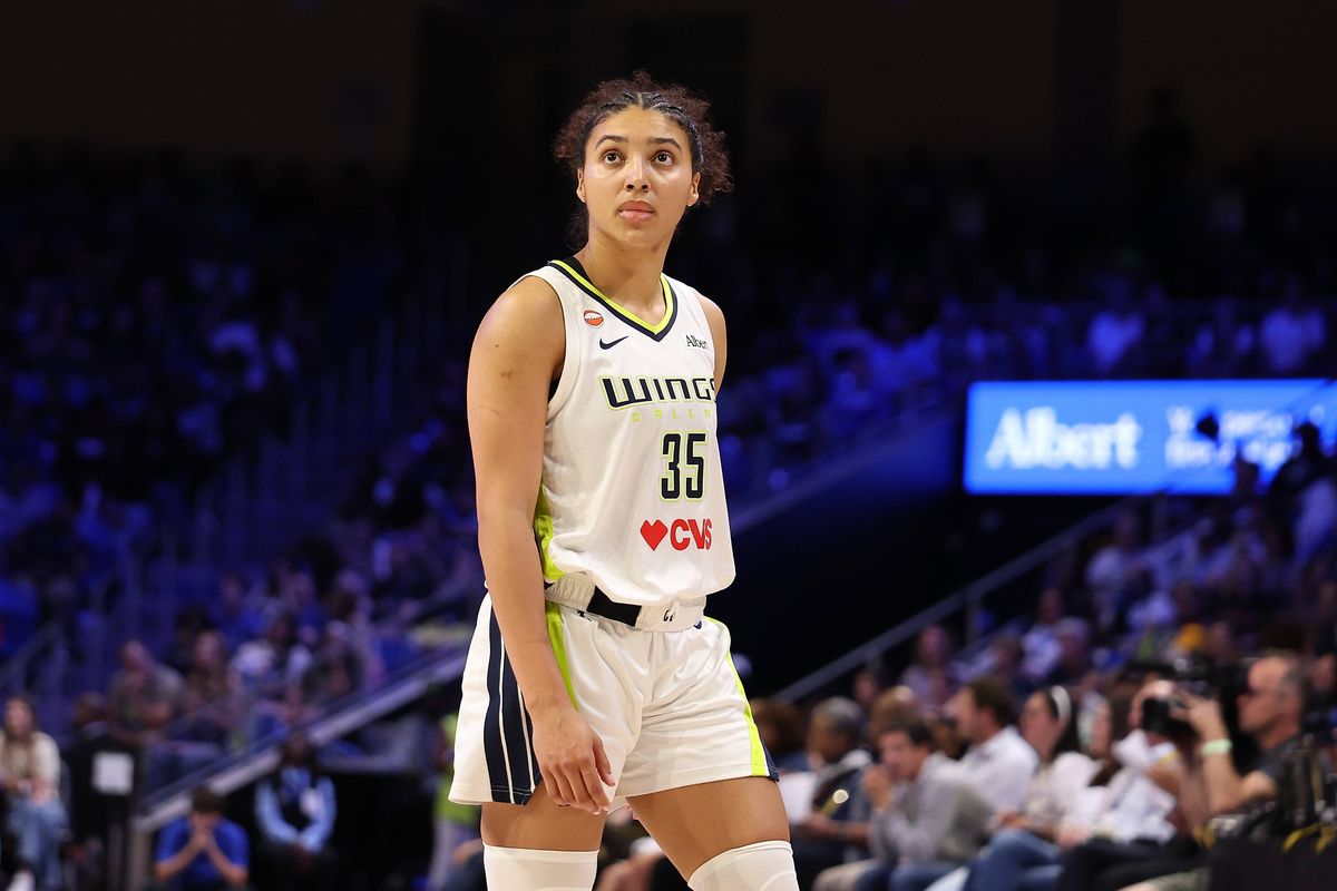 Azzi Fudd of the Dallas Wings looks on