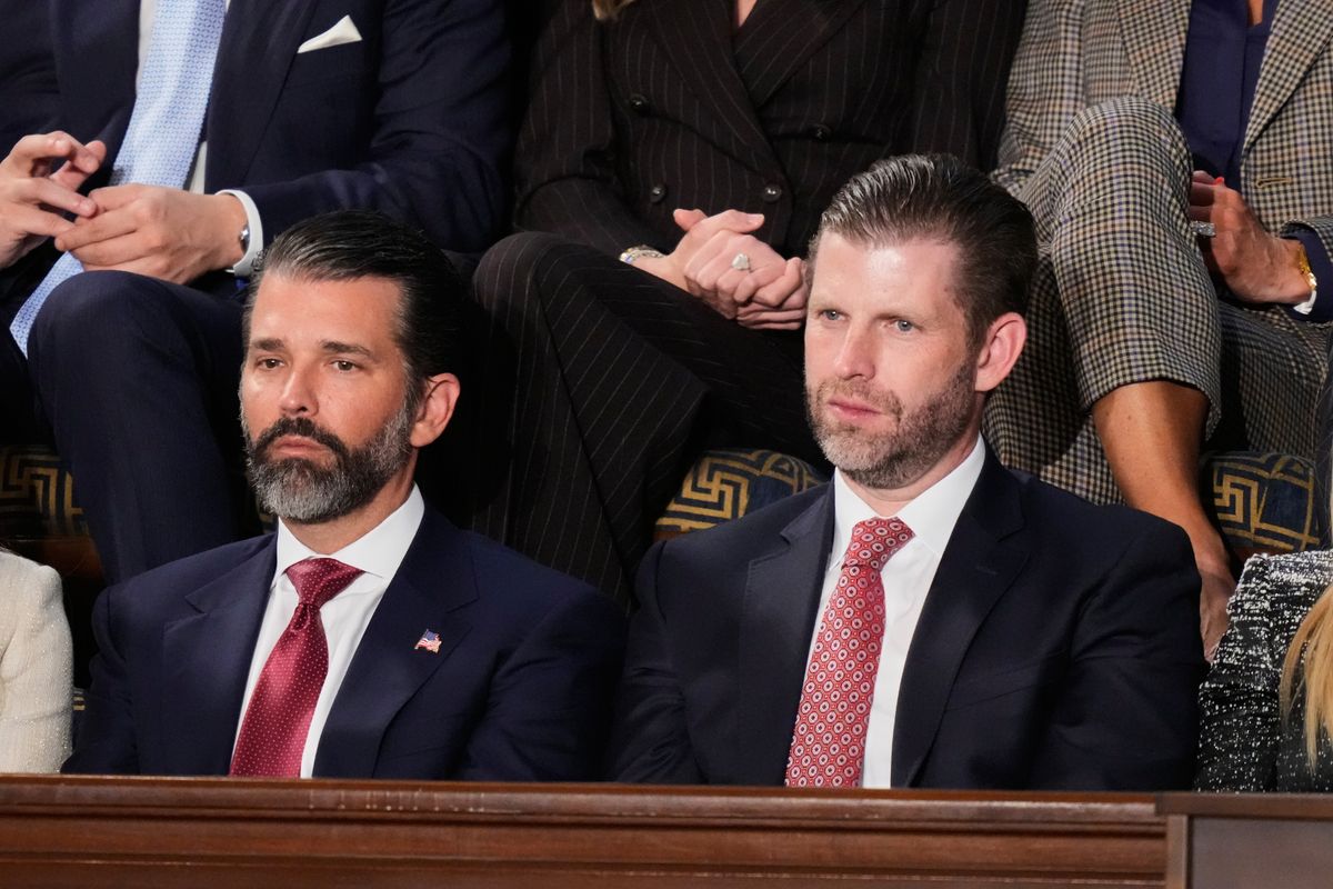 FILE - Donald Trump Jr. and Eric Trump listen to President Donald Trump's State of the Union address to a joint session of Congress in the House chamber at the U.S. Capitol in Washington, Tuesday, Feb. 24, 2026. (AP Photo/Alex Brandon, File)